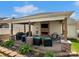 Inviting covered patio with stone fireplace, TV, and comfortable seating, perfect for outdoor living at 3020 Salmon River Dr, Monroe, NC 28110