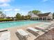 Community pool area offers lounge chairs and a pool house for residents at 3020 Salmon River Dr, Monroe, NC 28110