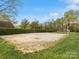 Outdoor volleyball court with well-maintained sand and surrounding greenery, providing a recreational space at 3020 Salmon River Dr, Monroe, NC 28110