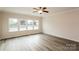 Inviting living room with large windows, hardwood floors, and plenty of natural light at 326 Nantucket Way, Rock Hill, SC 29732