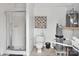 Bathroom showcasing a walk-in shower, toilet, wall art, and pool pump equipment at 3452 Flat Creek Rd, Lancaster, SC 29720