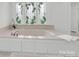 Close-up of a soaking tub next to a stained glass window in a luxury bathroom at 3452 Flat Creek Rd, Lancaster, SC 29720