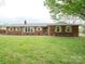 Attractive brick home with well-maintained landscaping and a classic design at 3452 Flat Creek Rd, Lancaster, SC 29720