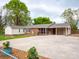 Ranch style home exterior with brick accents, a carport, and a well-manicured lawn at 3452 Flat Creek Rd, Lancaster, SC 29720