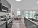 Bright kitchen area featuring stainless appliances, granite countertops, and an island at 3452 Flat Creek Rd, Lancaster, SC 29720