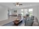 Bright, airy living room with tile flooring, large windows and comfortable seating, plus a view of the backyard pool at 3452 Flat Creek Rd, Lancaster, SC 29720