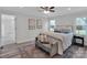 Bright bedroom with neutral decor, wood floors, and a cozy seating area at 3452 Flat Creek Rd, Lancaster, SC 29720