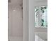 Walk-in shower with a tiled shower and stained glass window at 3452 Flat Creek Rd, Lancaster, SC 29720