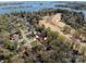 Scenic aerial shot showcases a tranquil neighborhood near a lake, nestled among mature trees at 3489 Lake Shore S Rd, Denver, NC 28037