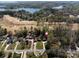 Stunning aerial view of lakefront homes surrounded by lush trees, with easy access to the open waters at 3489 Lake Shore S Rd, Denver, NC 28037
