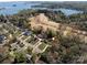 Beautiful aerial view of lakeside homes with lush green surroundings, near pristine blue waters at 3489 Lake Shore S Rd, Denver, NC 28037