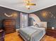 Cheerful bedroom with rainbow and butterfly accents, complemented by hardwood floors at 3489 Lake Shore S Rd, Denver, NC 28037