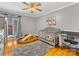 Gray finished bedroom with hardwood floors, a ceiling fan, and Bedroom furnishings at 3489 Lake Shore S Rd, Denver, NC 28037