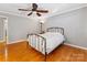 Bright bedroom with hardwood floors, ceiling fan, and comfortable bed, plus lots of light at 3489 Lake Shore S Rd, Denver, NC 28037