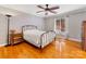 Relaxing bedroom featuring hardwood floors, ceiling fan and comfortable bed, plus lots of light at 3489 Lake Shore S Rd, Denver, NC 28037