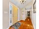 Bright entryway features hardwood floors and a view down the hall at 3489 Lake Shore S Rd, Denver, NC 28037