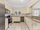 Traditional kitchen with white cabinets, granite countertops, and stainless steel appliances at 3489 Lake Shore S Rd, Denver, NC 28037