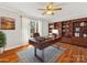 Elegant office featuring hardwood floors, custom built-ins, and a ceiling fan at 3489 Lake Shore S Rd, Denver, NC 28037
