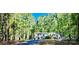 Charming single-story home nestled in a serene wooded setting at 368 Northwood Dr, Troy, NC 27371