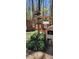 Quaint farm area with rustic structures, signage, and lush greenery, showcasing a rural lifestyle at 368 Northwood Dr, Troy, NC 27371