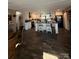 Spacious open kitchen with island, white cabinets, pendant lights, and modern appliances at 368 Northwood Dr, Troy, NC 27371