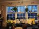 Cozy living room area with decorative pillows, plants, and a view of nature at 368 Northwood Dr, Troy, NC 27371