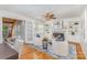 Cozy living room with fireplace, built-in bookshelves, and hardwood floors with blue accent rug at 3916 Riverbend Rd, Charlotte, NC 28210