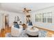 Comfortable sitting room featuring plush seating, stylish decor, and hardwood floors with accent rug at 3916 Riverbend Rd, Charlotte, NC 28210