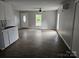 Open floor plan with hard wood flooring and plenty of natural light at 411 Weathers St, Shelby, NC 28150