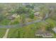 Wide aerial of multiple properties in a community, showcasing landscaping and street views at 417 Donna Ave, Gastonia, NC 28052