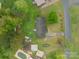 Bird's eye view of a property with a well-maintained yard, outbuildings, and mature trees at 417 Donna Ave, Gastonia, NC 28052
