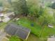 Wide aerial shot displaying house, outbuildings, and a swimming pool on the property at 417 Donna Ave, Gastonia, NC 28052