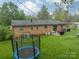 Aerial view of the backyard featuring a trampoline and well-manicured lawn at 417 Donna Ave, Gastonia, NC 28052