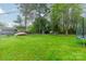 Spacious backyard with mature trees, a shed, and ample space for outdoor activities at 417 Donna Ave, Gastonia, NC 28052
