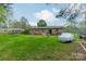 Spacious backyard with trampoline, patio furniture, trampoline and lots of green grass at 417 Donna Ave, Gastonia, NC 28052