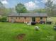 Aerial view of backyard with patio furniture and a well-maintained lawn at 417 Donna Ave, Gastonia, NC 28052