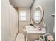 Updated bathroom with a shower, oval mirror, and white vanity at 417 Donna Ave, Gastonia, NC 28052
