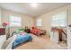 Cozy bedroom with two twin beds, soft carpet, and a bright window at 417 Donna Ave, Gastonia, NC 28052