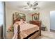 Comfortable bedroom with a four-poster bed, soft carpet, and a decorative painting at 417 Donna Ave, Gastonia, NC 28052