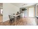 Bright dining room features hardwood floors, a modern table set, and a wall-mounted television at 417 Donna Ave, Gastonia, NC 28052