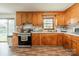 Charming kitchen features wooden cabinets, stainless steel appliances, and a bright window at 417 Donna Ave, Gastonia, NC 28052