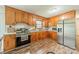Charming kitchen features wooden cabinets, stainless steel appliances, and a bright window at 417 Donna Ave, Gastonia, NC 28052