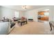 Open living room next to the kitchen, featuring comfortable seating and bright lighting at 417 Donna Ave, Gastonia, NC 28052