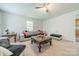 Bright living room with a large window, comfortable seating, and a ceiling fan at 417 Donna Ave, Gastonia, NC 28052