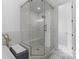 Modern bathroom featuring a large walk-in shower with glass door and marble surround at 4300 Old Course Dr, Charlotte, NC 28277