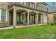 Covered patio with comfortable seating and backyard view at 4300 Old Course Dr, Charlotte, NC 28277