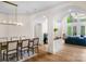Spacious dining room with hardwood floors, archways, and a dining table set for formal meals at 4300 Old Course Dr, Charlotte, NC 28277