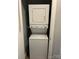 Compact laundry area with stacked washer and dryer, maximizing space and convenience at 508 S Jackson Ave, Waxhaw, NC 28173