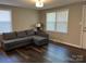 Bright living room featuring wood floors, a neutral color palette, and abundant natural light at 508 S Jackson Ave, Waxhaw, NC 28173