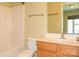 Bright bathroom featuring a vanity sink with a mirror, a toilet and a bathtub at 535 Donatello Ave, Charlotte, NC 28205